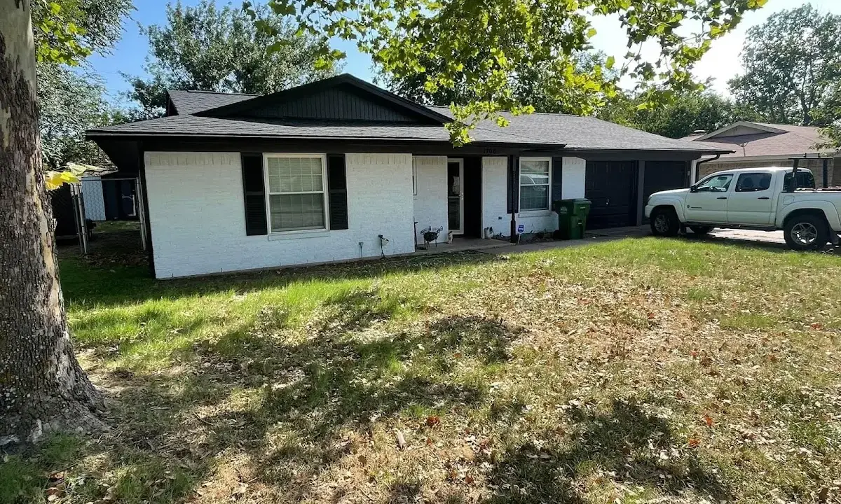 Professional roofing crew working on a residential roof in Wichita